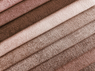 Fototapeta na wymiar Close up detail of classic brown tones color fabric texture samples. interior material for curtain or drapery.