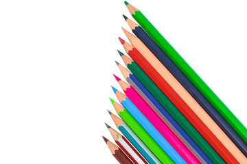 Line of different colored wood pencil crayons placed on a white paper background
