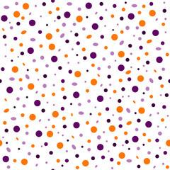 Seamless abstract pattern of circles of different sizes in a chaotic manner in the colors of Halloween on a white background. Design of products on the theme of Halloween textiles, packaging, bags