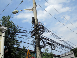 Tangled power cables on a pole