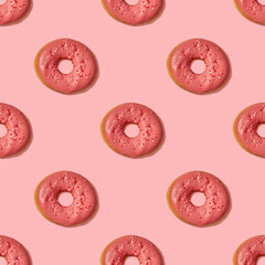 Seamless pattern of pink donuts on a pink background