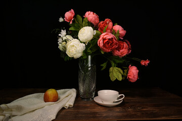 Still life in low key with black background.