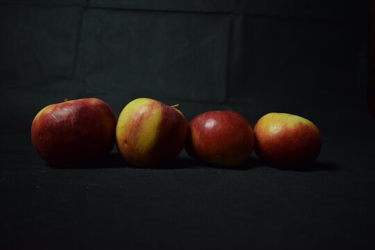 Still life in low key with black background.