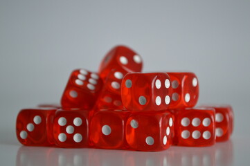 pile of multiple red plastic arcylic d6 six sided die dice variable focus