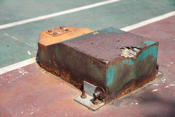 Metal pier on tennis court, detail texture