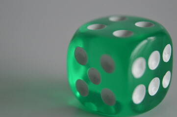 green plastic arcylic d6 six sided die dice close up variable focus