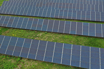 Renewable solar power plant. Aerial view as solar energy is converted by solar cells into electrical current. Alternative clean green energy renewable solar energy use. In Europe, Hungary.