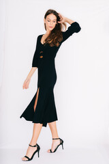 young woman in a dress, isolated on white.