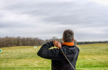 Golfer on driving range