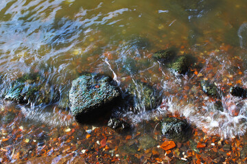 The rock on the bank of the river that has been eroded