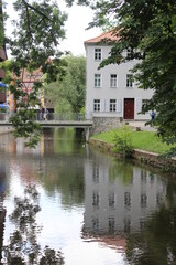 Fototapeta na wymiar River Gera running through the old town of the German city of Erfurt, in the state of Thuringen. 