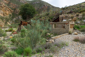 old sand screening plant between mountains