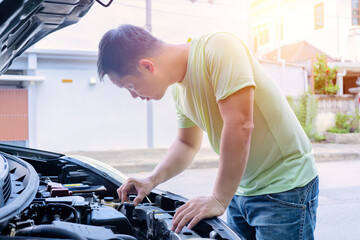 Auto mechanic checking car engine,worker