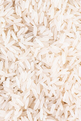 Food background from a texture of basmati rice, close-up