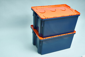 Plastic storage boxes. Boxes for the delivery of products. Orderly storage.