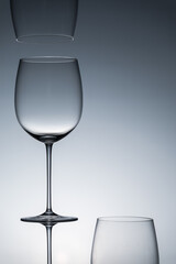 Empty wine glasses on a clean gradient background