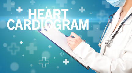 doctor writes notes on the clipboard with HEART CARDIOGRAM inscription, first aid concept