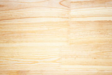 Naklejka premium A sand-colored wooden board is laid on the floor. Wood background and texture.