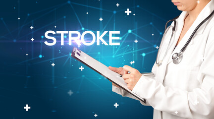 Doctor fills out medical record with STROKE inscription, medical concept