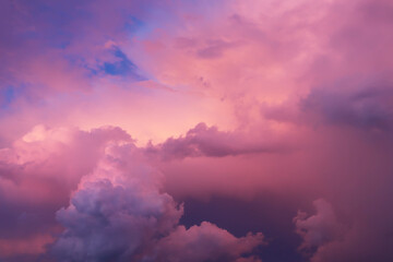 Fototapeta premium clouds and the sky in bright pink blue and blue tones. fabulous, magical sky. The image can be used to decorate a banner and a postcard. Background.