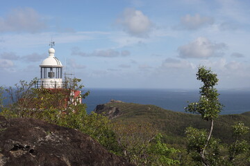 Fototapeta na wymiar La Trinité / Martinique - April 19 2018: Lighthouse Phare de la Caravelle in natural resort Presqu'Île Caravelle on Caribbean Island Martinique