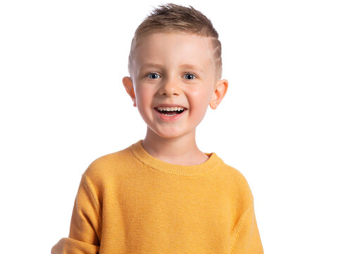 Portrait of a beautiful European boy 6 years old on a white background. The happy child is laughing out loud. Children's emotions.