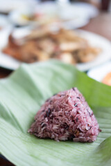 Black sticky rice on banana leaf