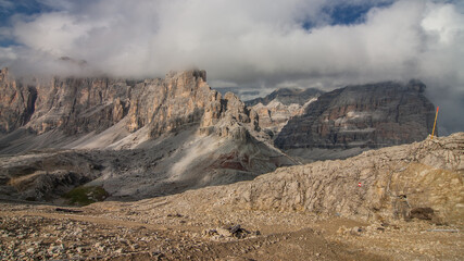 On the final stretch to  Refugio Lagazuoi at the end of the long and relentless uphill climb on stage 2 of Alta Via 1 trek from Refugio Fanes to Refugio Lagazuoi, Dolomites, South Tirol, Italy.