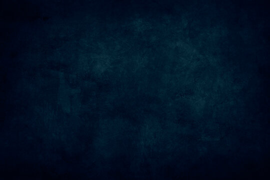 dark blue stained grungy background or texture