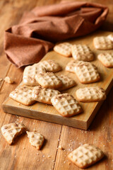 Cinnamon Wafer Cookies dipped in caramelized chocolate, on wooden background.