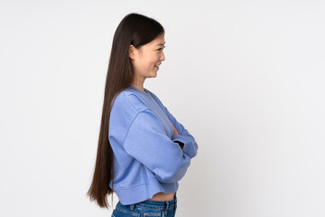 Young asian woman isolated on background in lateral position