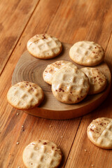 Cinnamon Wafer Cookies dipped in caramelized chocolate, on wooden background.