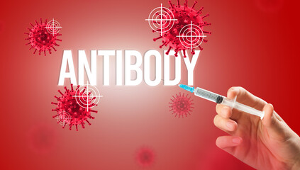 Close-up view of doctor's hand in a white glove holding syringe with ANTIBODY inscription, coronavirus antidote concept