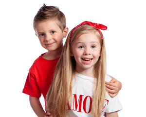 Two children-a beautiful blonde European girl and a boy with blue eyes smiling on a white background. Portrait of beautiful children. Childhood friendship, first love. Brother and sister.