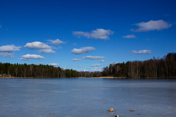 View of the frozen Vuoksa River and clouds. Sunny winter landscape.