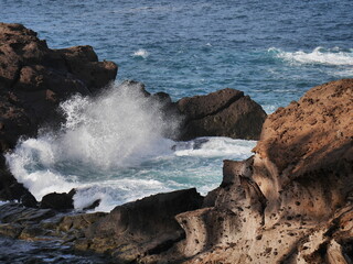 waves crashing on rocks