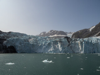 Surprise Glacier and ices floating in the sea . Prince William Sound, Alaska, USA.