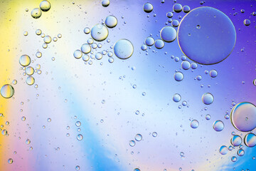 Colorful artistic image of oil drop on water for modern and creation design background.