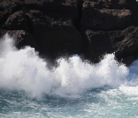 waves crashing on rocks