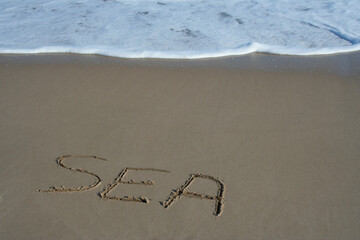 sea marqué sur la plage