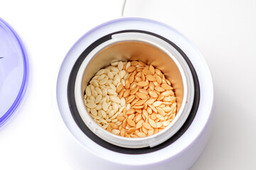 Electric wax warmer or wax heater with wax drops inside while heating the wax