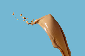 Photo of coffee or brwon liquid splash with drops isolated on black background. Close up view