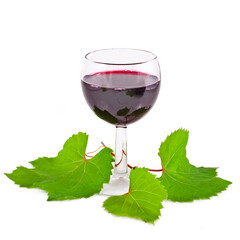 Red wine in the glass with grape and leaves isolated on a white background.