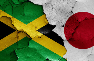 flags of Jamaica and Japan painted on cracked wall