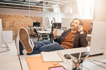 Happy adult male daydreaming about future achievement