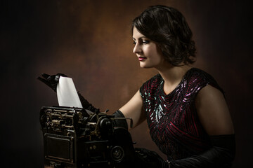 Elegant Young secretary with typewriter 1920s years