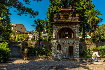 Fototapeta na wymiar A square in the Garden of Villa Comunale, Taormina, Sicily in summer