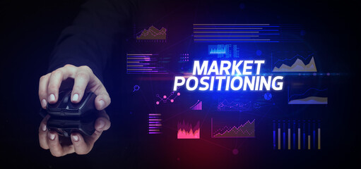 hand holding wireless peripheral with MARKET POSITIONING inscription, cyber business concept