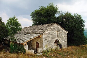 Fototapeta na wymiar Traditional stone-made country church at Vitsa village, one of Zagoria villages in north-western Greece.