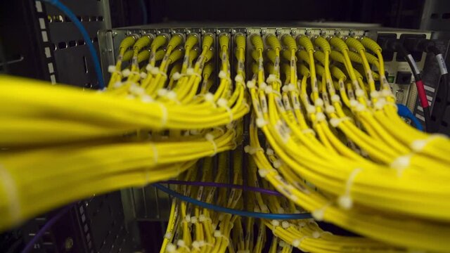 Back Side Of Modern Working Data Center Servers With Yellow Cable - Cloud Service And E-Commerce, Upload And Download Server  - Zoom In
